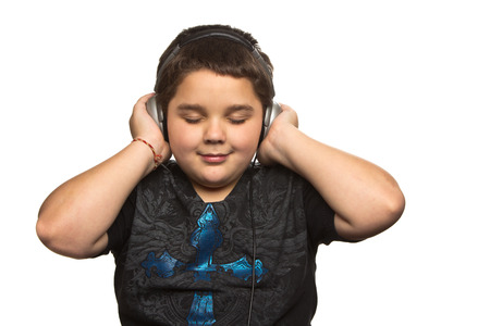 Boy with headphones isolated on white の写真素材
