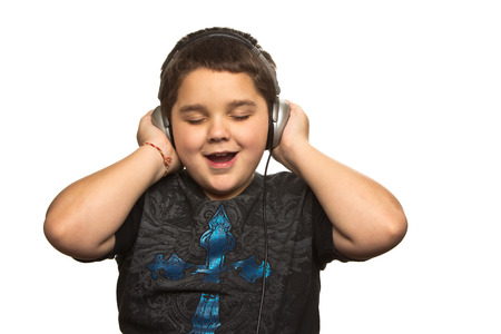 Boy with headphones isolated on white の写真素材