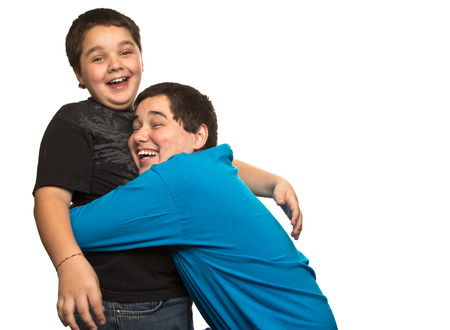 surprise hug between two brothersの写真素材