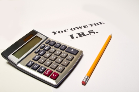 calculating what tax is owed to the I R S の写真素材