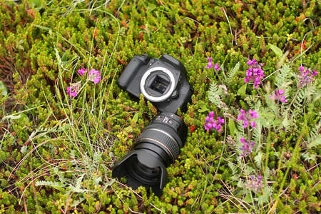The camera and lens lying separatelyの写真素材