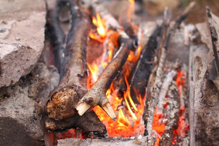 A fire in the fireplace of stonesの写真素材