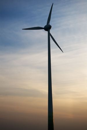 wind turbine on sunset sky background
