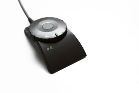 disk type control with green diode light shining