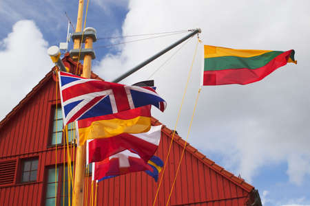 Lithuanian flag with some other european flags near the Klaipeda yacht harbourの写真素材