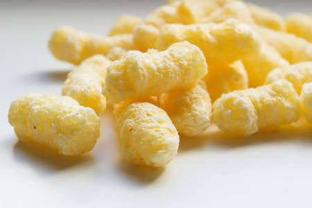 pile of  corn flake sticks on white backgroundの写真素材