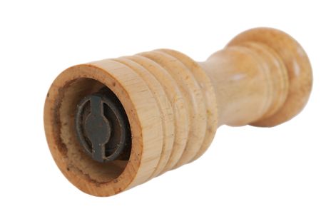 wooden pepper grinder isoalted on whiteの写真素材