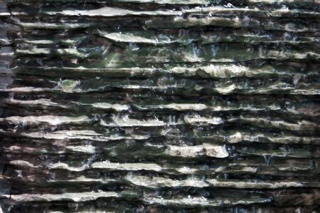 abstract  water running over uneven surface backgroundの写真素材