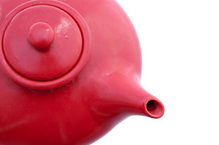 red teapot fragment isolated on whiteの写真素材