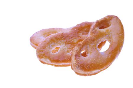 three sweet sugar glazed pretzels isolated on white