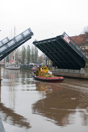 KLAIPEDA, LITHUANIA  NOVEMBER 10: tugboat arrives to move Klaipeda city symbol barquentine "Meridianas"  to the major overhaul on November 10, 2012 in Klaipeda.のeditorial素材