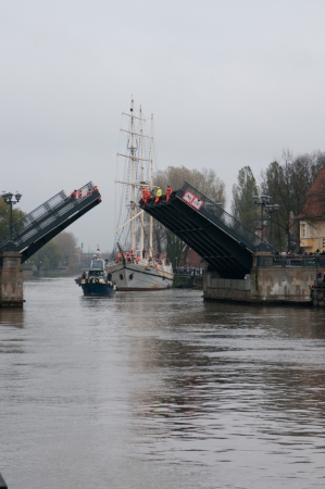 KLAIPEDA, LITHUANIA  NOVEMBER 10: the first drawbridge all set for pass of Klaipeda city symbol barquentine "Meridianas" which moves from the berth  to the major overhaul on November 10, 2012 in Klaipeda.のeditorial素材