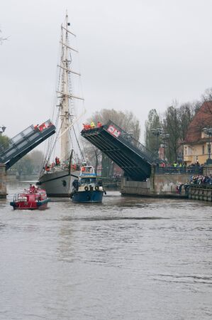 KLAIPEDA, LITHUANIA  NOVEMBER 10: Klaipeda city symbol barquentine "Meridianas" passes  the first drawbridge on the way to the major overhaul on November 10, 2012 in Klaipeda.のeditorial素材