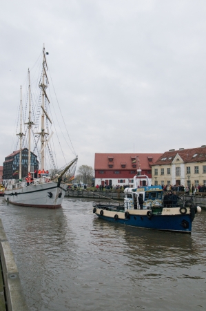 KLAIPEDA, LITHUANIA  NOVEMBER 10: Klaipeda city symbol barquentine "Meridianas"  tugged by tugboat to the major overhaul  on November 10, 2012 in Klaipeda.のeditorial素材