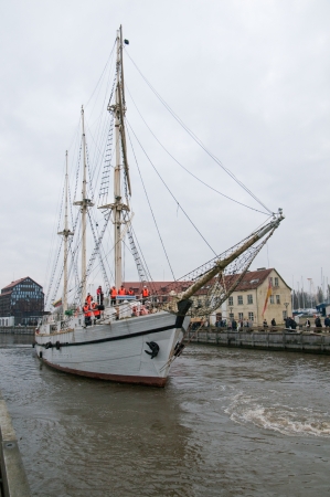 KLAIPEDA, LITHUANIA  NOVEMBER 10: Klaipeda city symbol barquentine "Meridianas"  approaches river mouth on her way to the major overhaul  on November 10, 2012 in Klaipeda.のeditorial素材