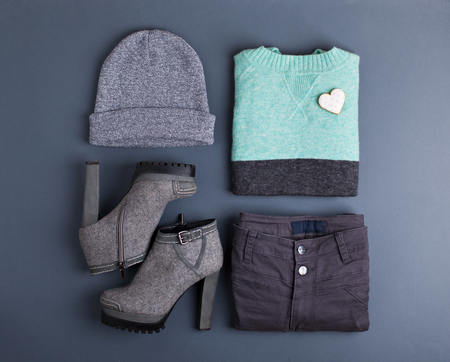 Women's outfit. Fashion clothes and accessories in pastel colors on gray background. Flat lay, top view.の写真素材