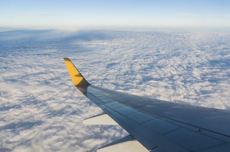 Looking at the wings during flight on airspace.の写真素材