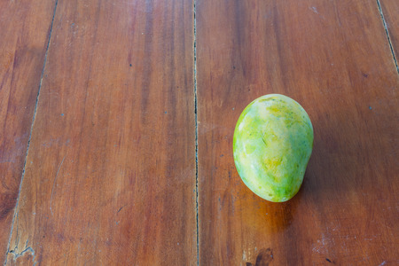 Mango on a table wood background.の写真素材