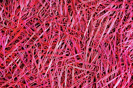 paper clip red color backgroundの写真素材