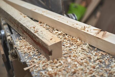 bar of a light tree before processing on the jointer planeの写真素材