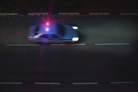 The car goes on the road lights the road headlights. The view from the top.の写真素材