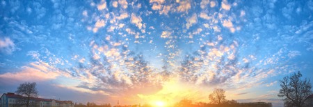 The sun shines from behind the clouds. Cirrus.