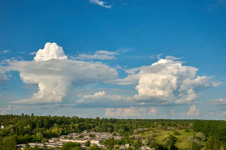 Beautiful blue clouds of unusual shape at the horizon level. Sky.の写真素材