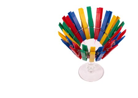 Glass with pegs isolated on whiteの写真素材