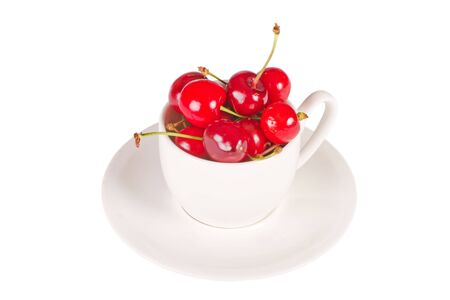 Cherry in cup isolated on the white backgroundの写真素材