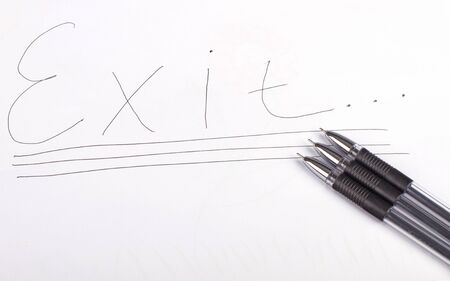 Three black pen and word exitの写真素材