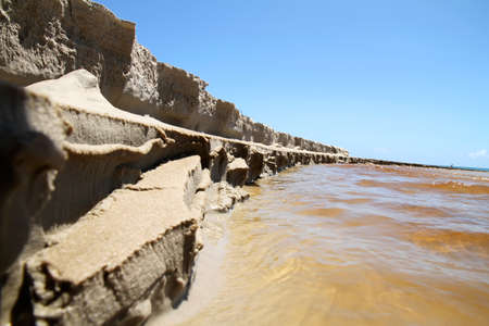 A River flowing into the Ocean. Picture taken in Bahia, Brazil.の写真素材