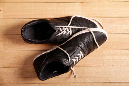Black sneakers on the floor の写真素材