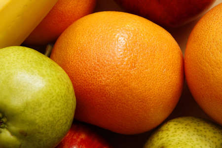 A background of Fruits - Oranges, Bananas, Apples and Pears の写真素材