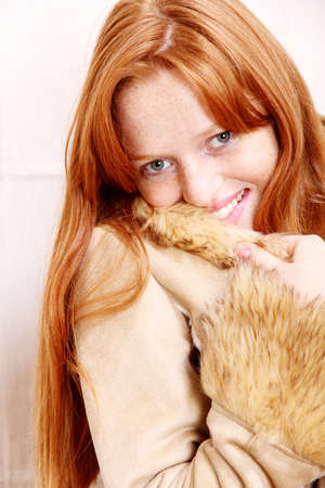 A attractive young, redhead  woman in Winter clothing.  の写真素材