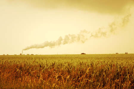 A retro-style Photo of a polluting factory の写真素材