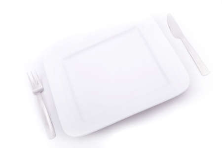 A blank plate isolated on white.の写真素材