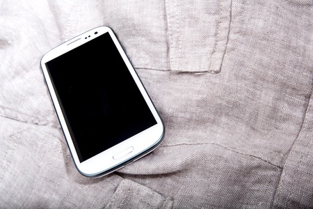 A Smartphone on some dark cloth.の写真素材
