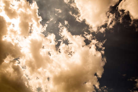 A blue sky with some fluffy clouds.