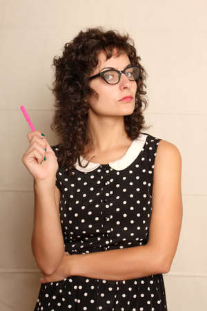 Portrait of a pensive woman in a vintage dress.の写真素材