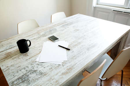 Brainstorming and taking notes at the table.