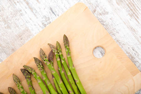 Fresh Asparagus on a wooden tablet.の写真素材