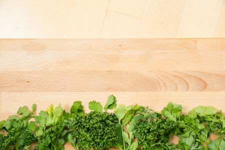 Kirchen herbs on a wooden cutting board.の写真素材