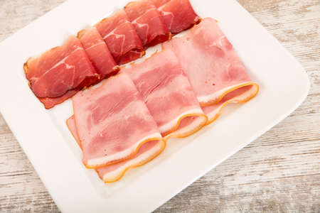 Sliced ham on plate.