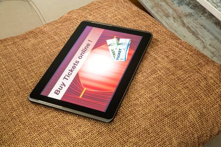 Buy Cinema Tickets online with a Tablet PCの写真素材