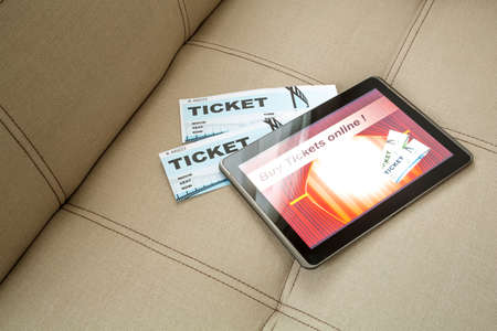 Buy Cinema Tickets online with a Tablet PCの写真素材
