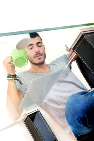 Young male thinking in the office