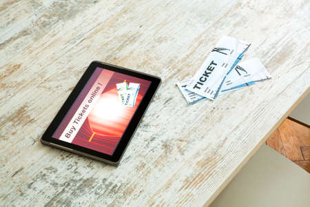 Buy Cinema Tickets online with a Tablet PCの写真素材