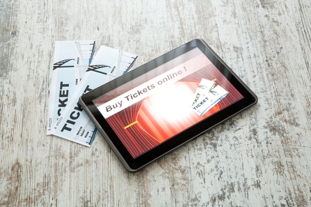 Buy Cinema Tickets online with a Tablet PCの写真素材