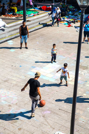 BUDAPEST, HUNGARY - AUGUST 31: Refugees and illegal immigrants playing football at the eastern Train Station on August 31, 2015 in Budapest, Hungary.のeditorial素材