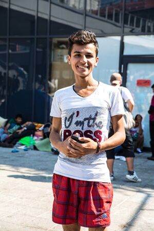 BUDAPEST, HUNGARY - AUGUST 31: A young male refugee stranded at the eastern Train Station on August 31, 2015 in Budapest, Hungary.のeditorial素材